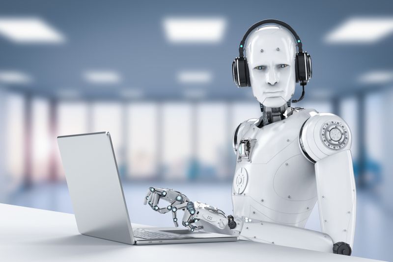 3D rendering of a white humanoid android typing on a laptop and wearing a headset, staring at the camera