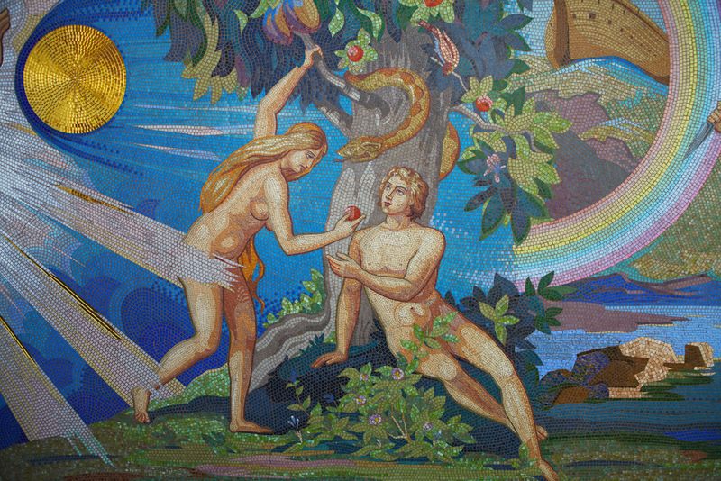 Mosaic panel in a church showing Adam and Eve in the Garden of Eden. 