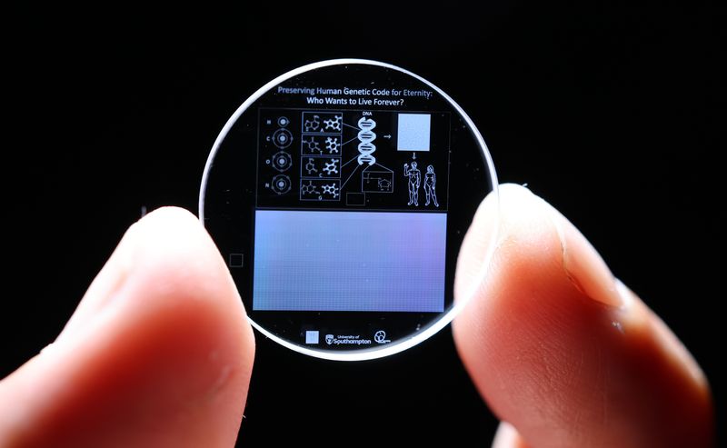 Tiny memory crystal encoded with full human genome held between two fingers