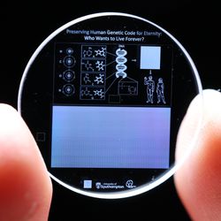 Tiny memory crystal encoded with full human genome held between two fingers