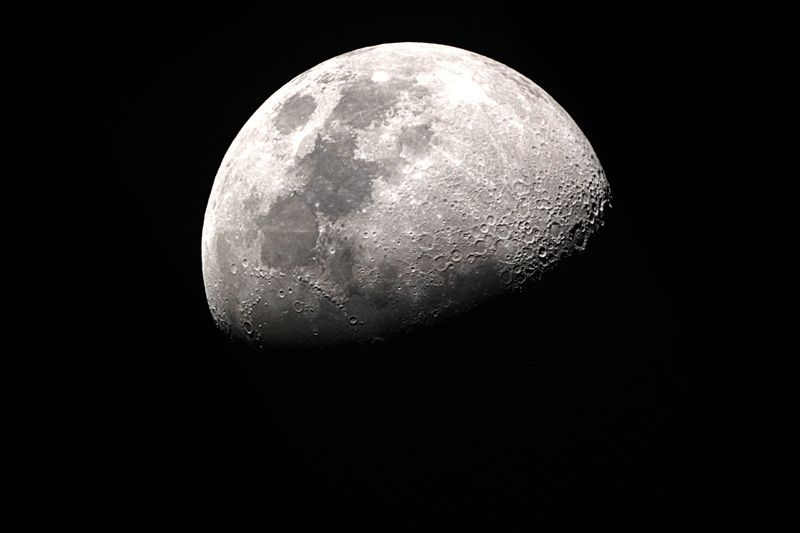 A photo of the moon half in shadow