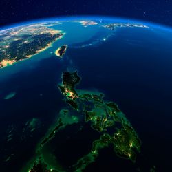 Artist enhanced view of the Philippines from space with no clouds at night