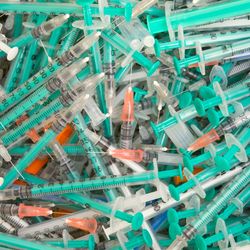 Pile of disposable syringes