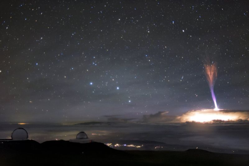 A red sprite and blue jet seen on top of a thunderstorm captured near Mauna Kea in Hawaii in 2017.