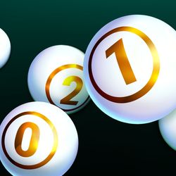 White shiny balls with golden text of numbers isolated on dark background