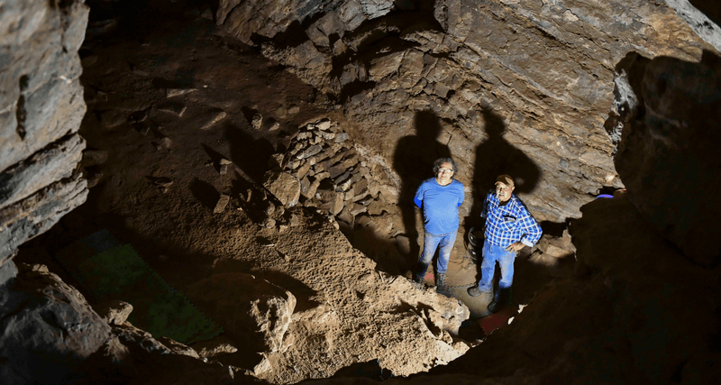 GunaiKurnai Elder Uncle Russell Mullett and Monash University's Professor Bruno David in Cloggs cave where evidence of the oldest continuously practiced ritual in the world has been found.