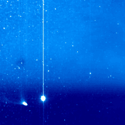 Comet Pons-Brooks (lower left) with its tail on the point of breaking off. Jupiter appears nearby, while the coronal mass ejection is swirling off the Sun, which is out of view to the right.