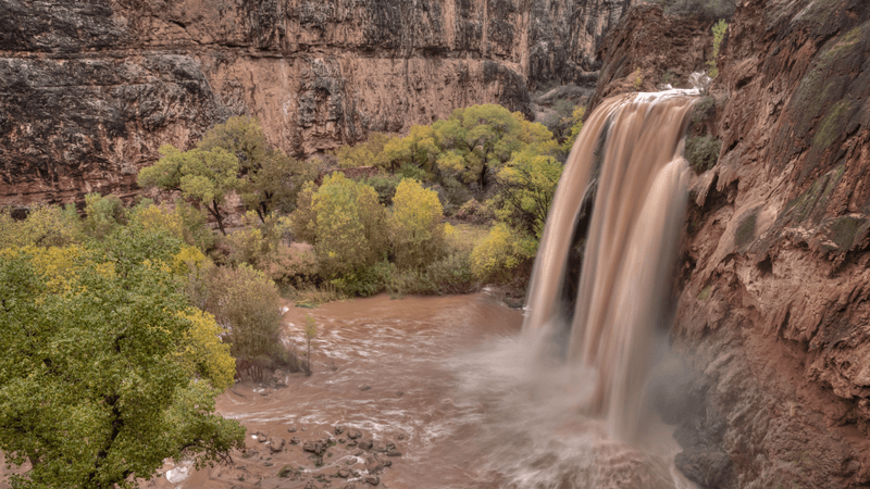 a waterfall during flash floods in the grand canyon national park