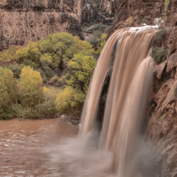 a waterfall during flash floods in the grand canyon national park