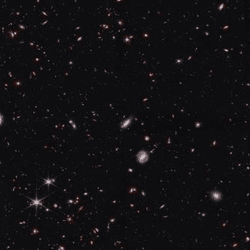 Part of the field observed by NASA’s James Webb Space Telescope’s NIRCam (Near-Infrared Camera) for the Cosmic Evolution Early Release Science (CEERS) survey. Some of these galaxies are brighter than expected, but whether that is a problem or not is not so clear..