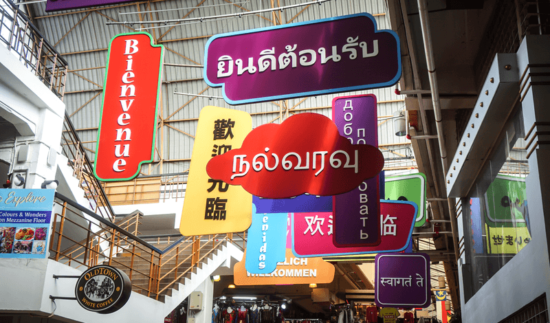 Multilingual signs hanging from the roof inside the central market, Kuala Lumpur, Malaysia, Asia 