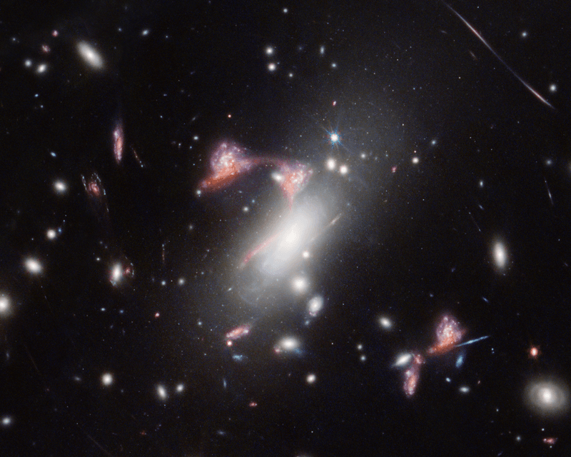 Two distant, interacting galaxies — a face-on spiral and a dusty red galaxy seen from the side — appear multiple times, tracing a question mark on the sky. The main body of the character is create with a bright white boxy galaxy