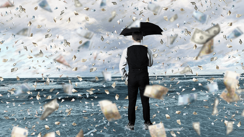 A man using an umbrella because it's raining cash.