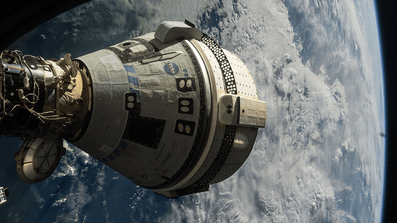 The Starliner capsule attached to the ISS.