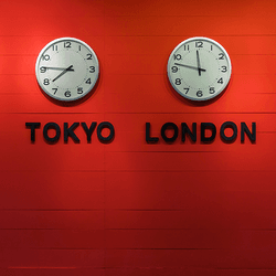 Four clocks, showing the time in different time zones.